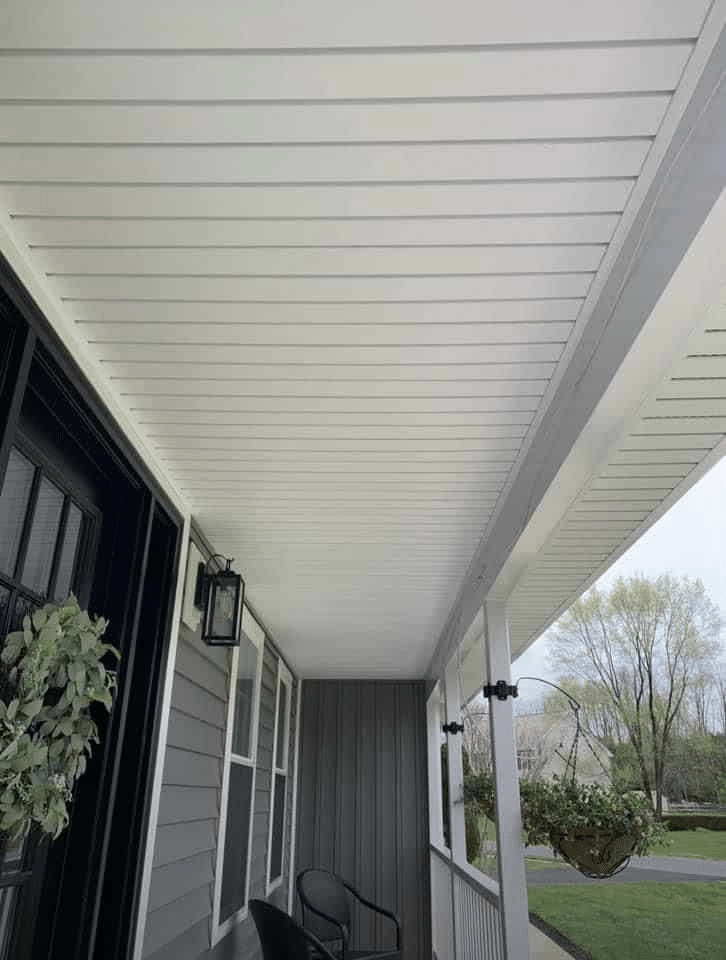 unnamed Covered front porch featuring a white soffit ceiling, black trim, and outdoor seating area.