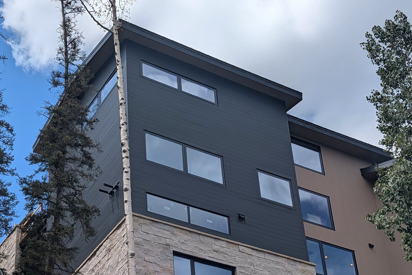 Matte Midnight Black metal siding installed by Western Slope Metals on a home in Mountain Village