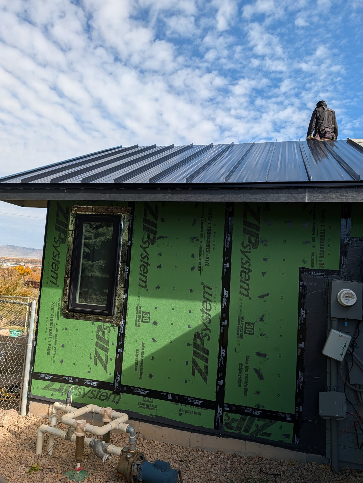 Dark standing seam metal roof panels installed by Western Slope Metals, Grand Junction CO