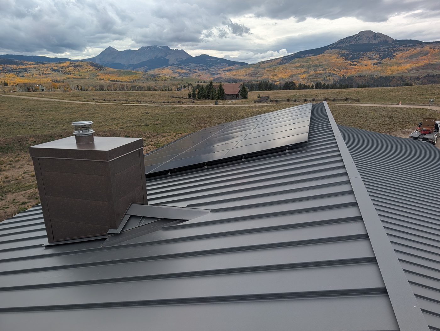 Standing seam roof and chimney chase on Wilson Mesa in fall