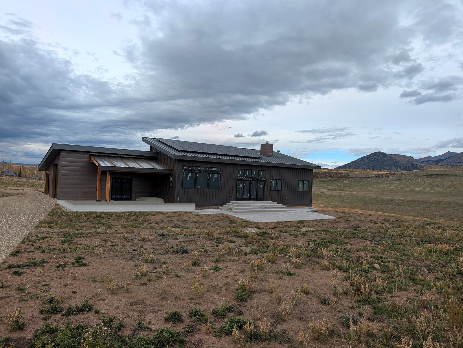 Mountain home on Wilson Mesa near Telluride with a Gray Zinc Matte standing seam metal roof and Matte Patina siding